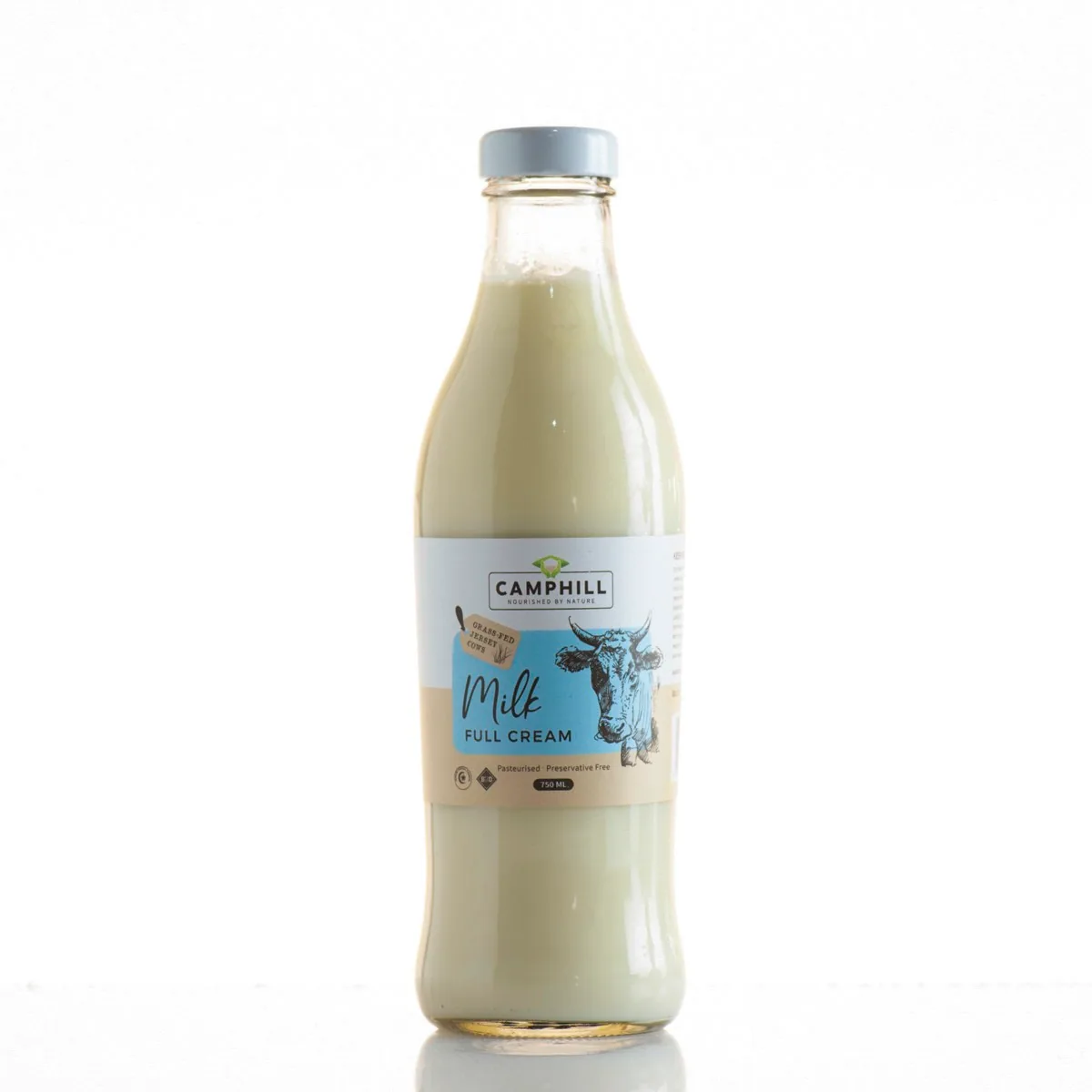 Glass bottle of Camphill full cream milk with a silver cap