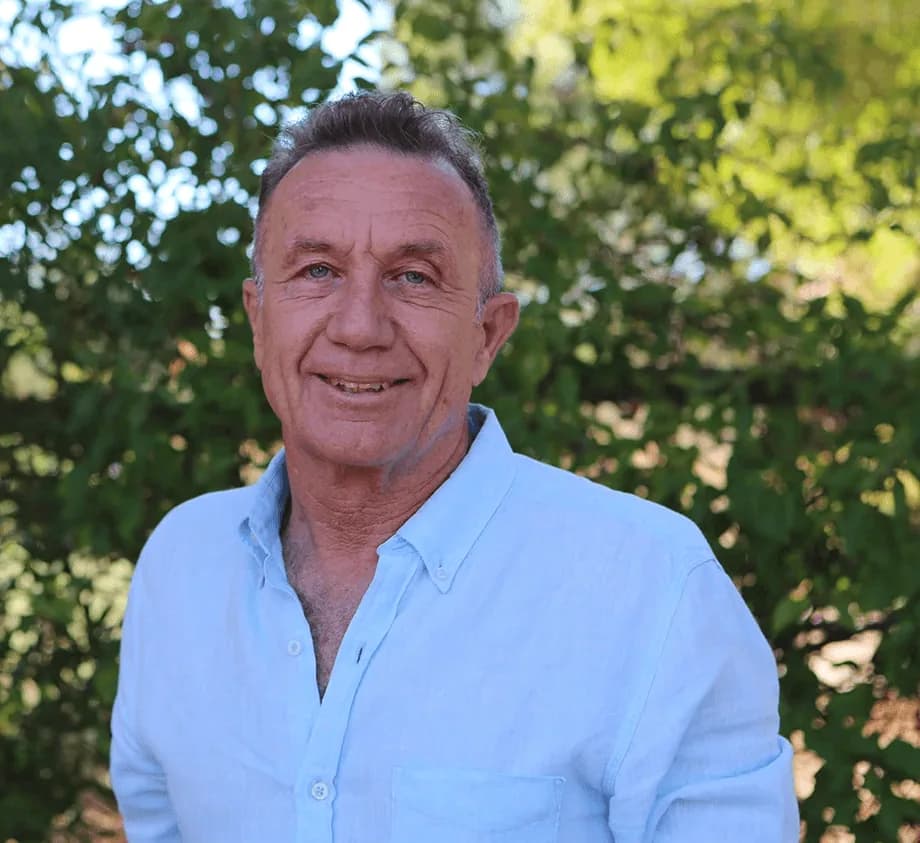 Portrait of James Sleigh, CEO, photographed among the trees at Camphill Village.