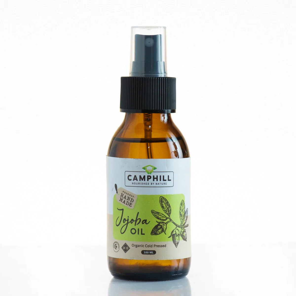 Camphill organic cold pressed Jojoba Oil in an amber glass spray bottle