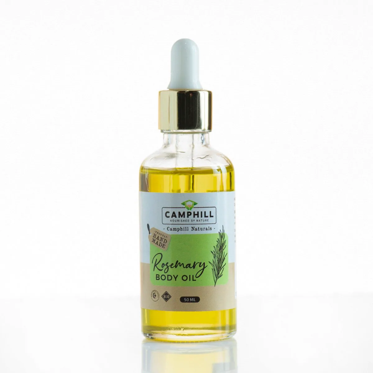 Camphill Rosemary Body Oil in a clear glass dropper bottle