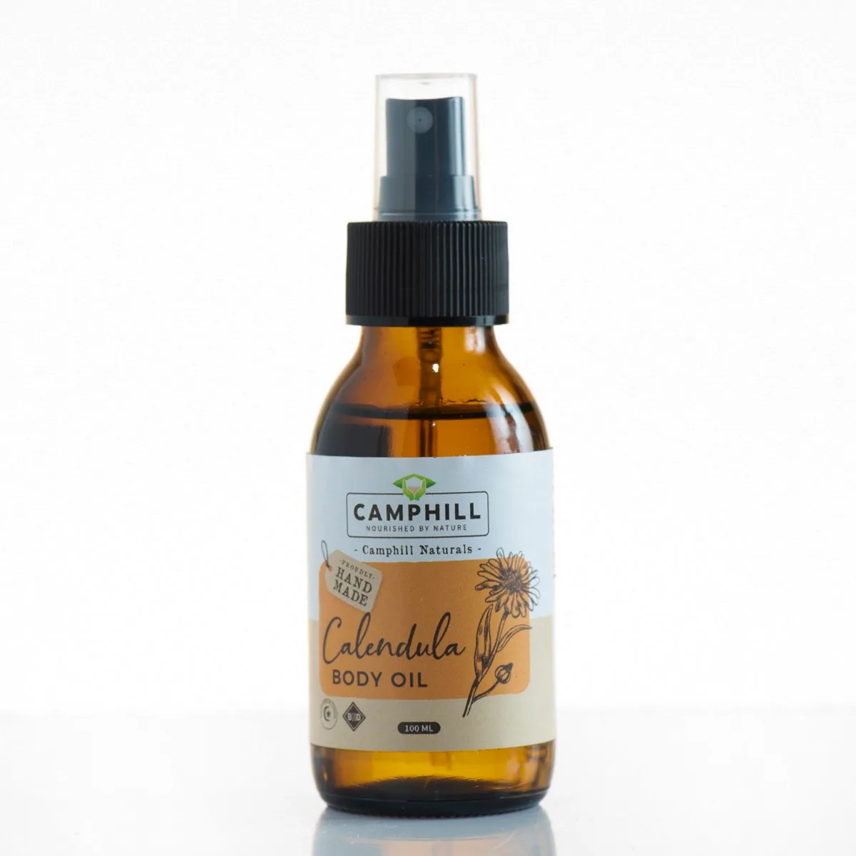 Camphill Calendula Body Oil in an amber glass spray bottle